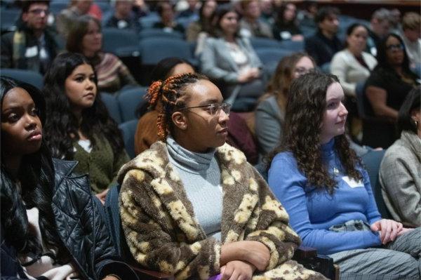 Audience members listen to TaRita Johnson's address during MLK Week