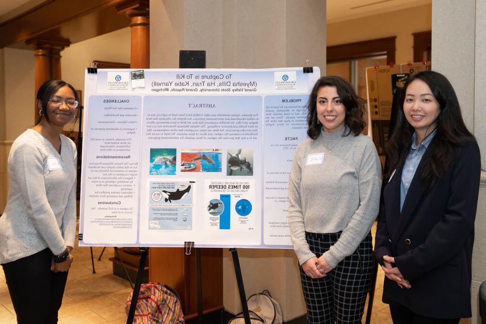  Ha Tran, Myesha Dills and Katie Yarnell worked together on research about protecting marine life. 